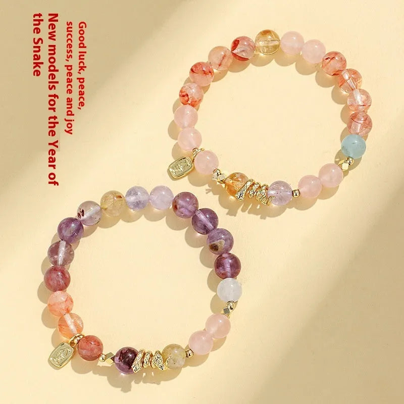 Women's lucky snake bracelet with crystal beads, plastic flowers, and a beast pattern design.
