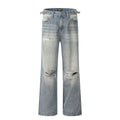 Blue retro-style men's straight-leg jeans with distressed detailing on a solid background