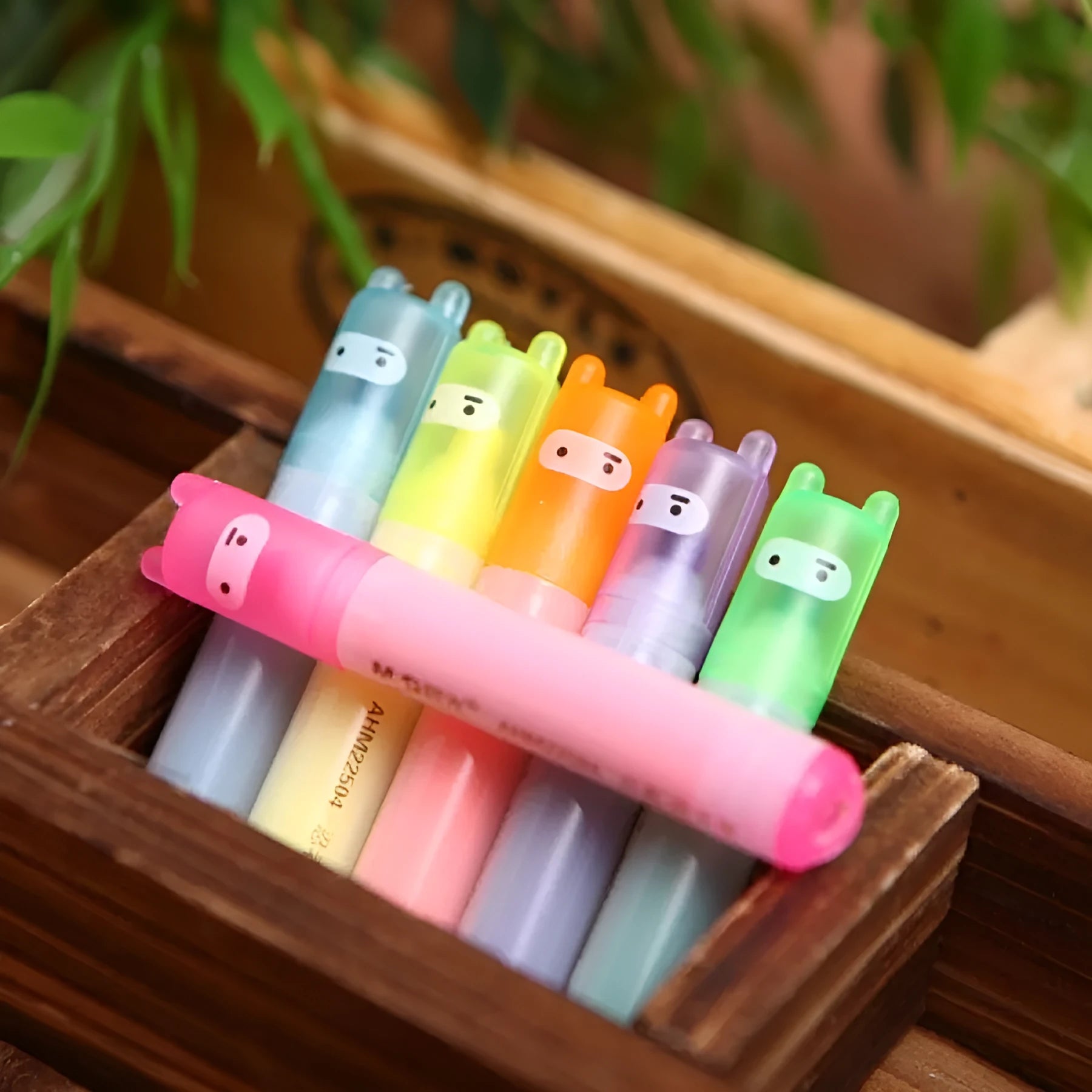 Set of six plastic highlighter pens with oblique tips in different colours for text marking