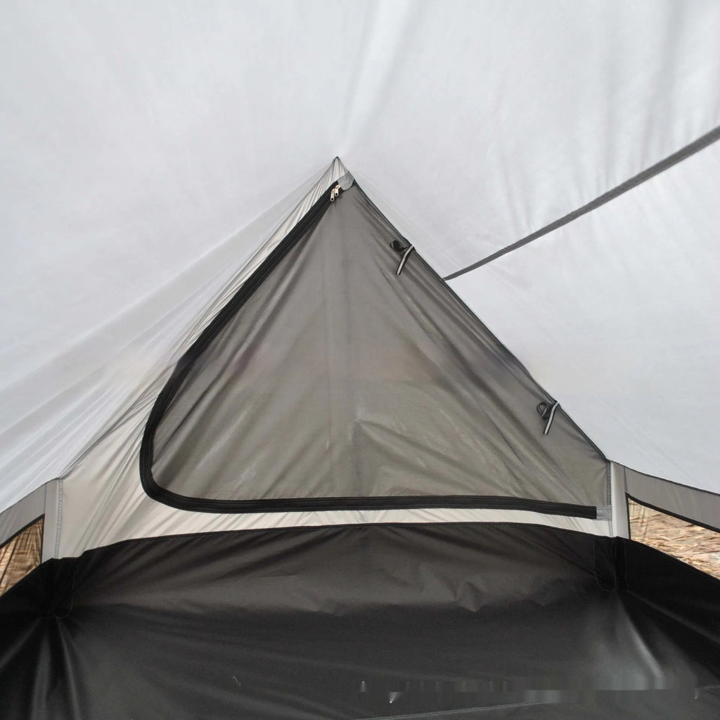 Brown A-line pole-free cabin tent pitched with hiking canes showing spacious interior dimensions