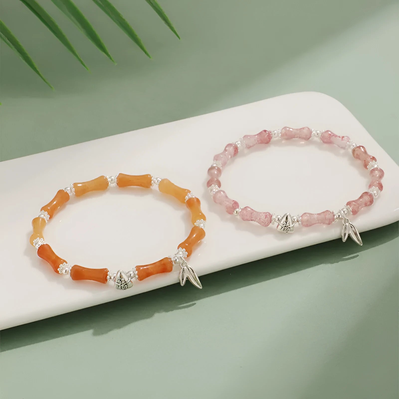 Electroplated bamboo strawberry crystal bracelet for women in green aventurine, showing natural stones on a bracelet.
