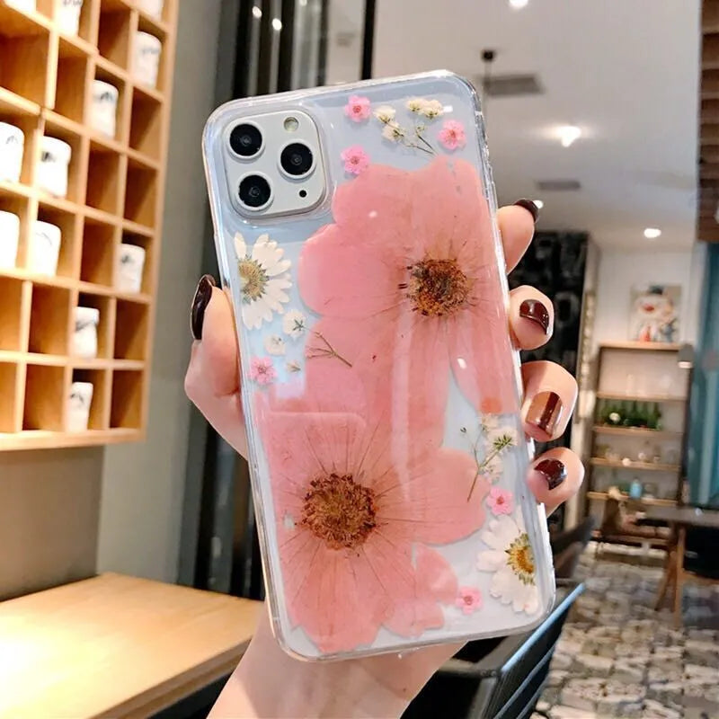 Floral TPU phone case with large flower pattern, available in pink and yellow versions, showing back cover design for iPhones