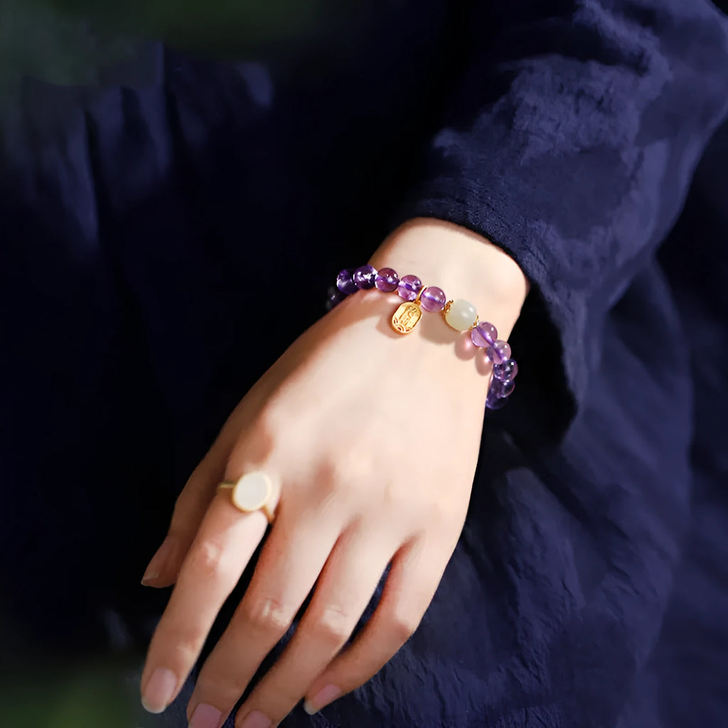 Amethyst purple crystal bracelet with 8mm geometry-shaped beads on wrist