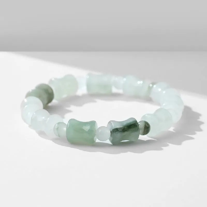Korean style beaded bracelet with diamond shaped chalcedony and coconut shell beads on an elastic cord.