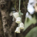 Green and white knitted wool car plant decoration with 8cm base and 25cm hanging rope