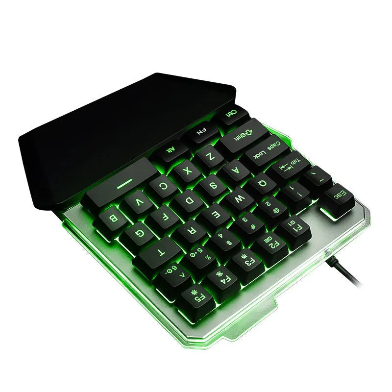 Black one-handed mechanical gaming keyboard with RGB backlit keys on a desk.