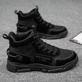 Men's black lace-up Martin ankle boots with canvas upper and wedge heel on a neutral background