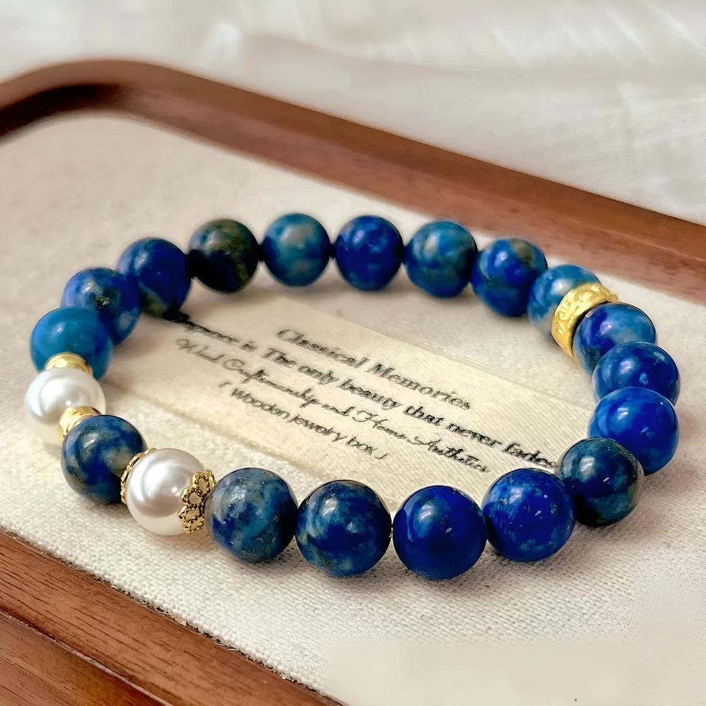 Natural green and gold lapis lazuli stone bracelet with a Chinese retro design on a wrist.