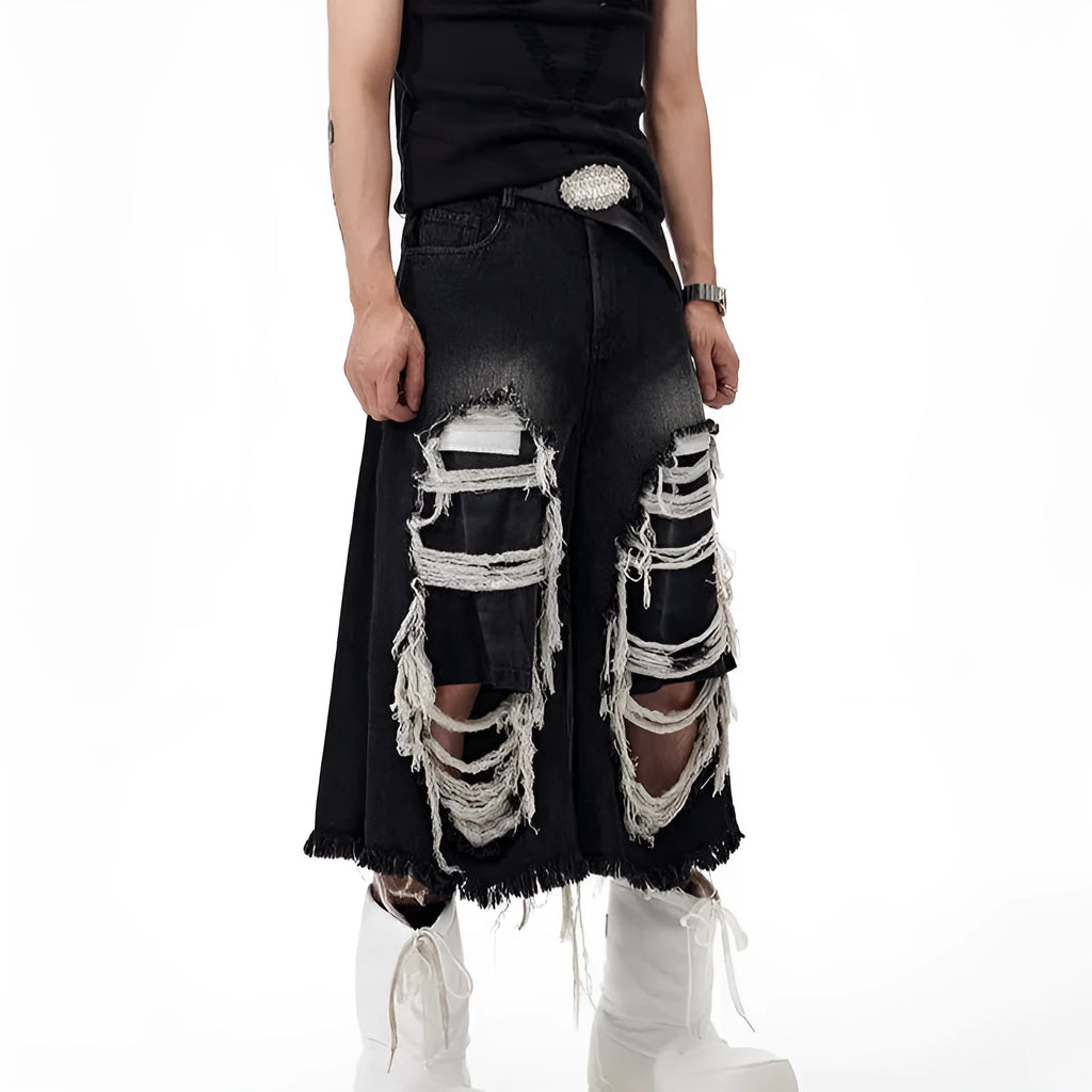 Black women's cropped wide-leg jeans with ripped patch details on the legs.