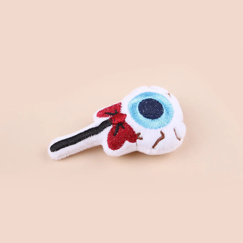 Colourful plush cat teaser wand with candy and eye-shaped attachments for interactive play