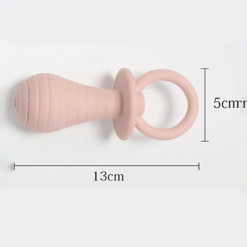 Set of four coloured TPR pet pacifier chew toys with squeakers for puppies and kittens.