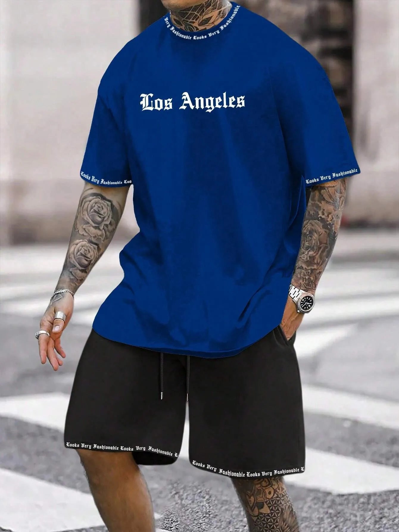 Men's blue printed short sleeve top and matching shorts sports set laid flat