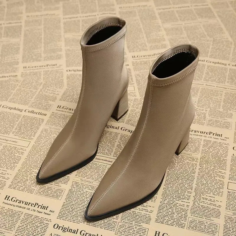 Women's pointed toe boots in stretch artificial suede with mid-heel wedge design