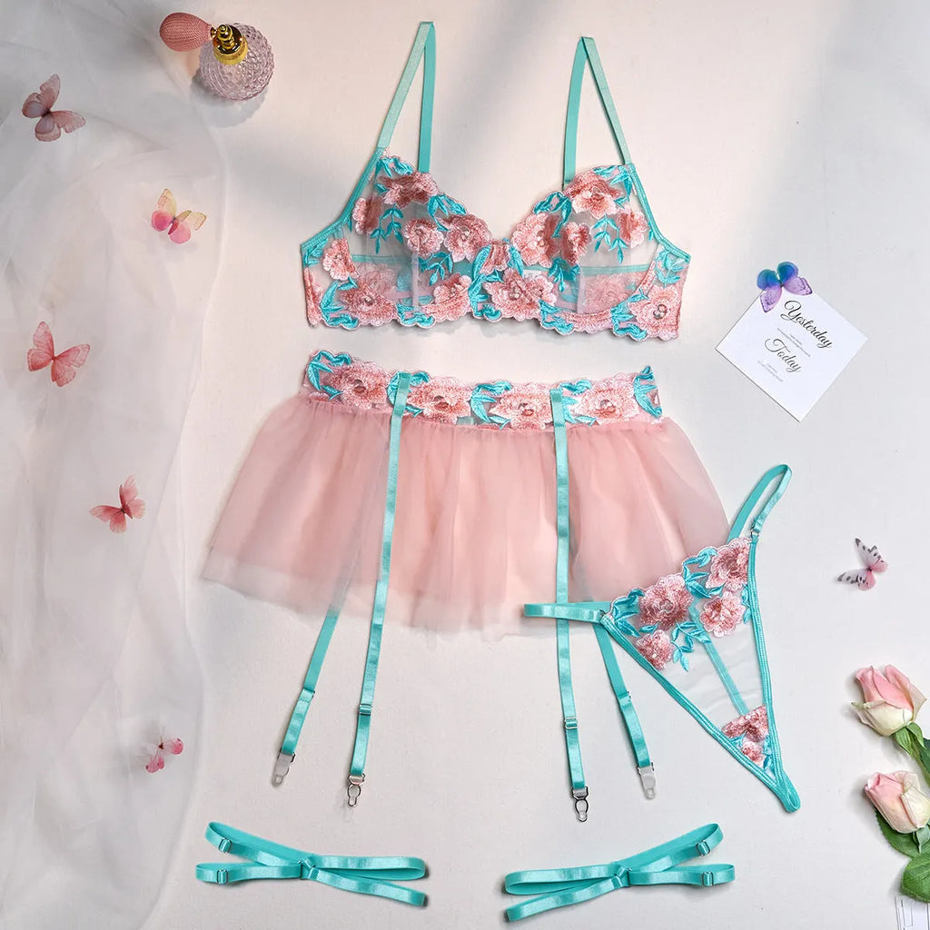 Pink women's mesh pettiskirt and bikini set with embroidery detail.