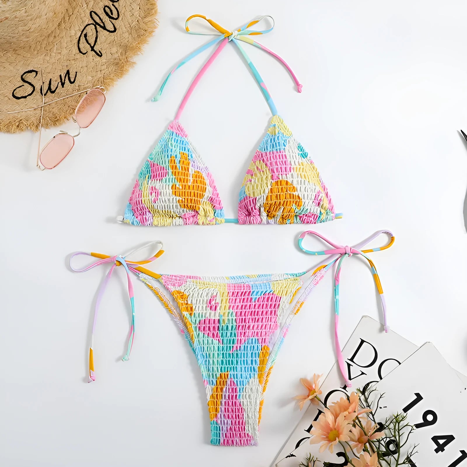 Women's floral print triangle bikini with smocking detail on the briefs, shown in multicolour.