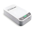 White UV disinfection box open showing internal compartment with UV lights, mobile phone inside