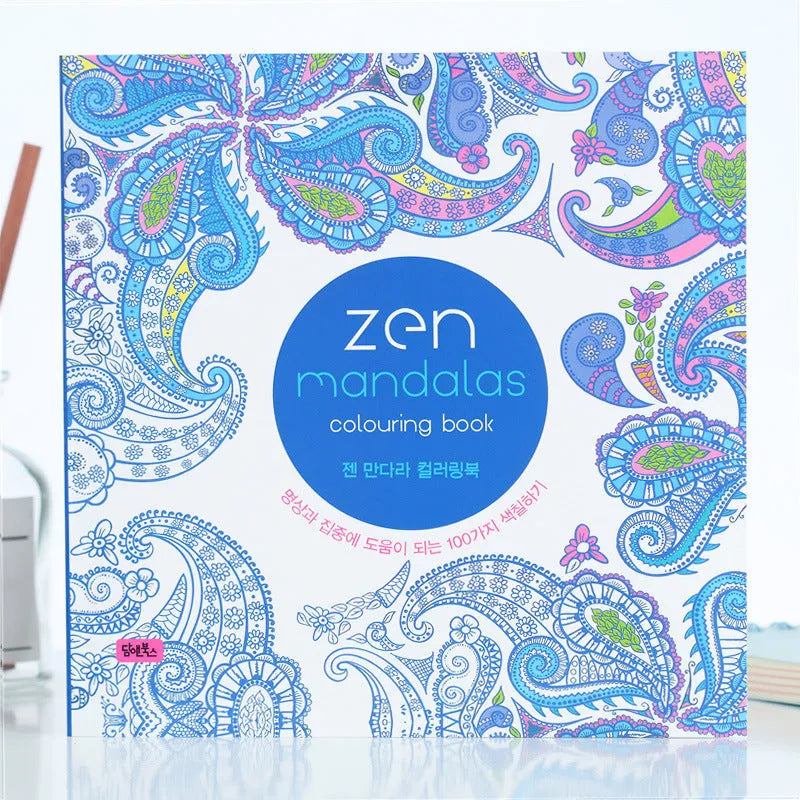 A5 mandala colouring book open showing black ink patterns on white paper with soft binder cover