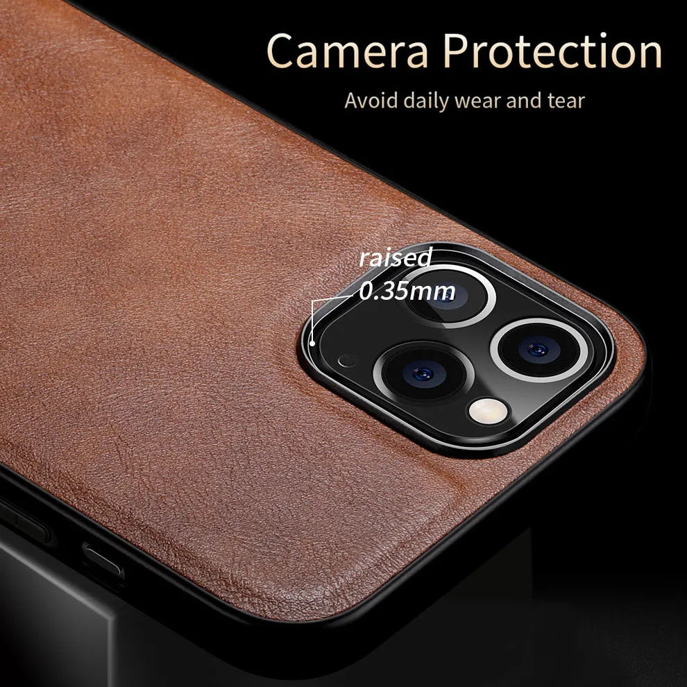 Black business leather phone case for iPhone 12 with PU leather and TPU frame on a wooden desk.
