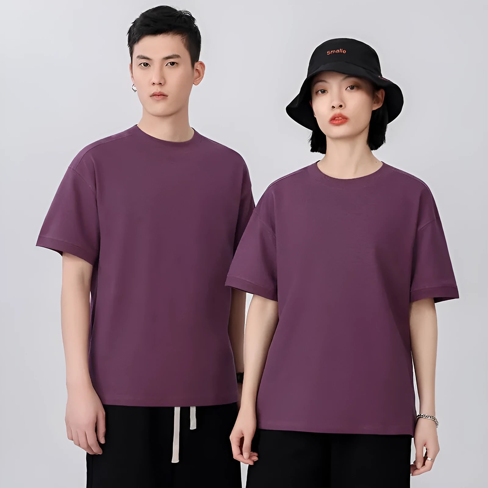 Men's loose-fit short-sleeved cotton pique t-shirt on a hanger, shown in a solid colour.
