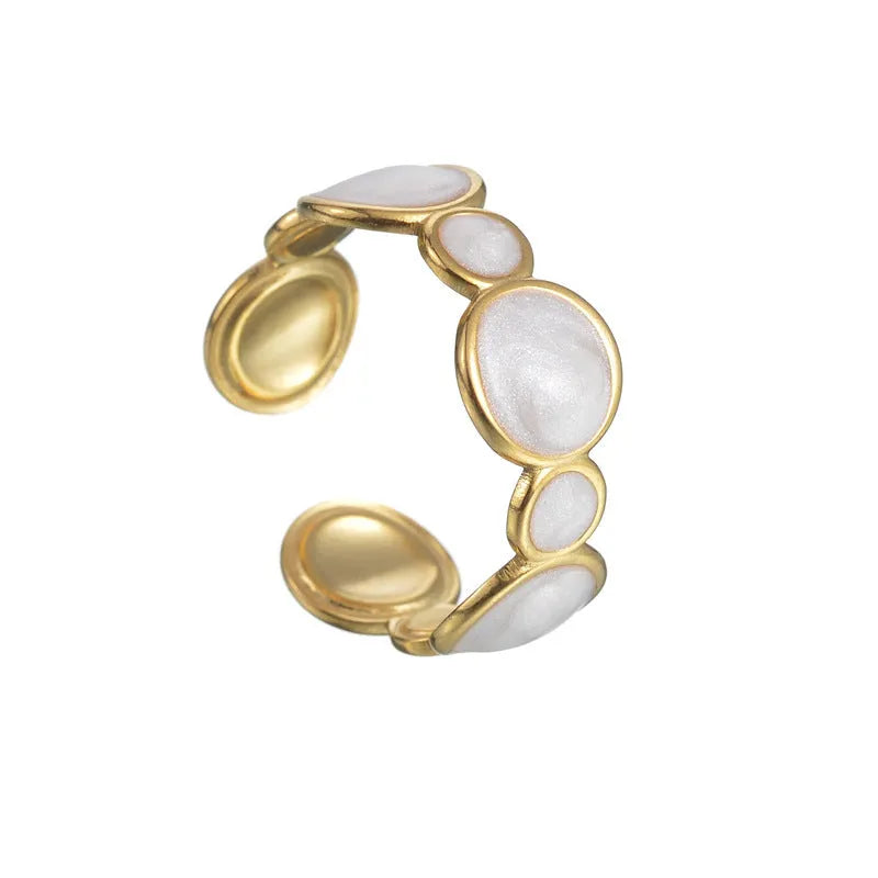 A geometric adjustable ring for women made of electroplated stainless steel on a plain background.