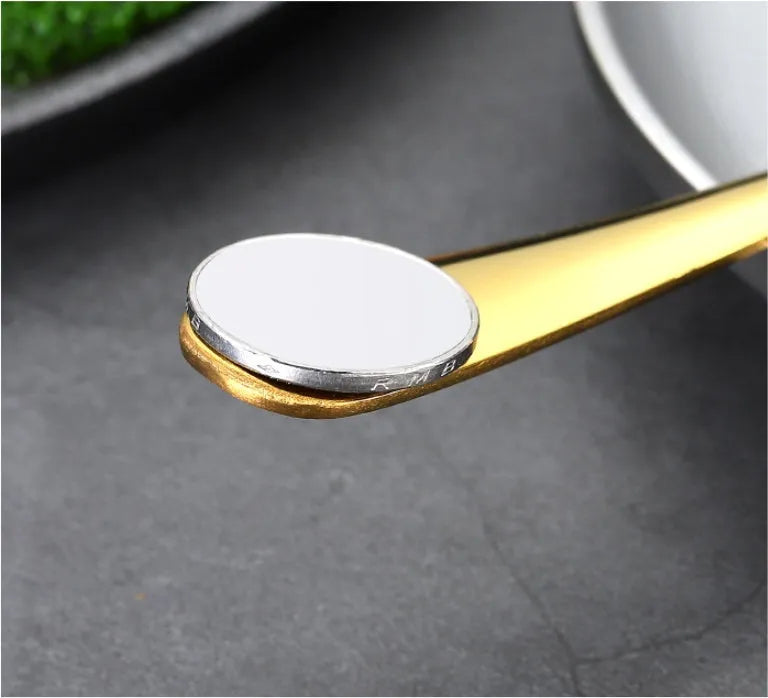 24 piece stainless steel tableware set showing knives, forks, and spoons in multiple colour finishes
