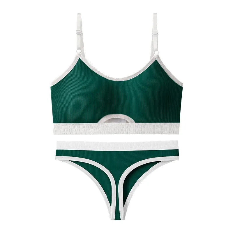 Women's black sports bra and panty set with underwire, moulded cups, and contrast colour back detailing.