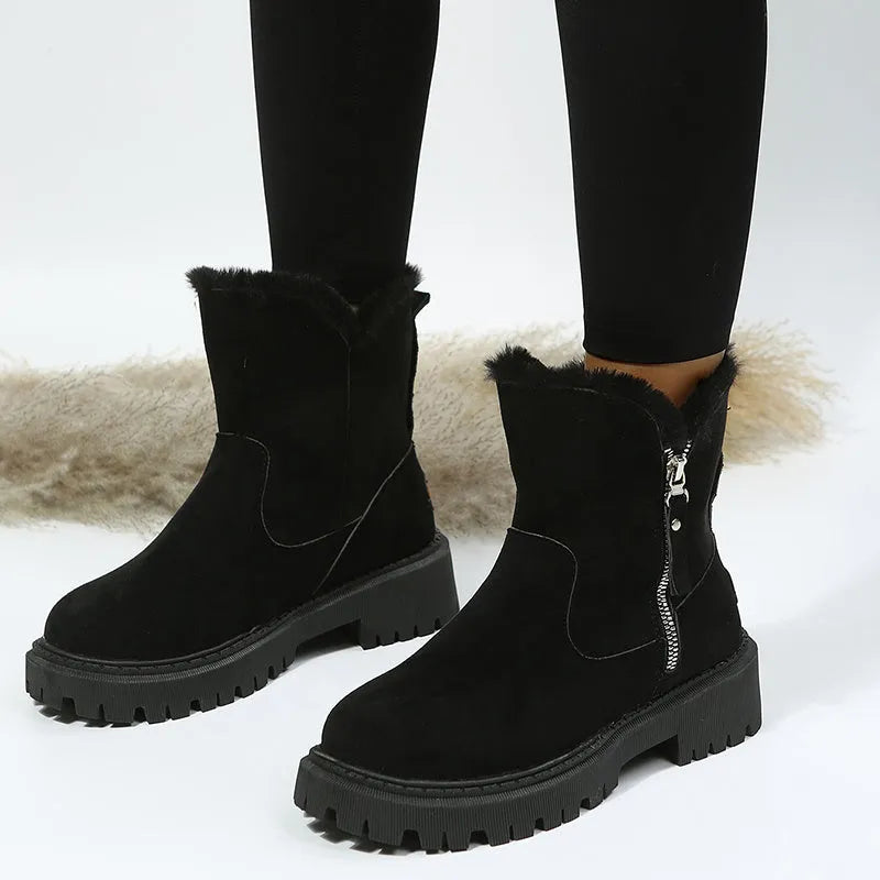 Women's black thick plush snow boot with side zipper and round toe on a rubber sole.