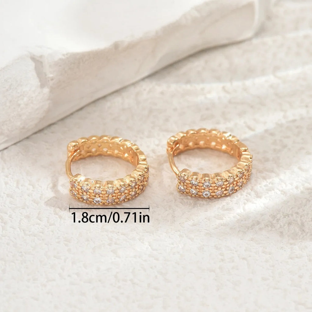 Geometric pattern copper ear studs in colour DE20288 showing round, dot, and ring design elements.