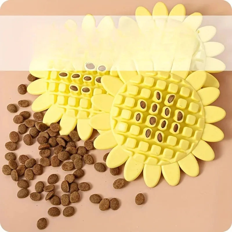 Yellow rubber sunflower dog chew toy with green stem, shown on a white background.