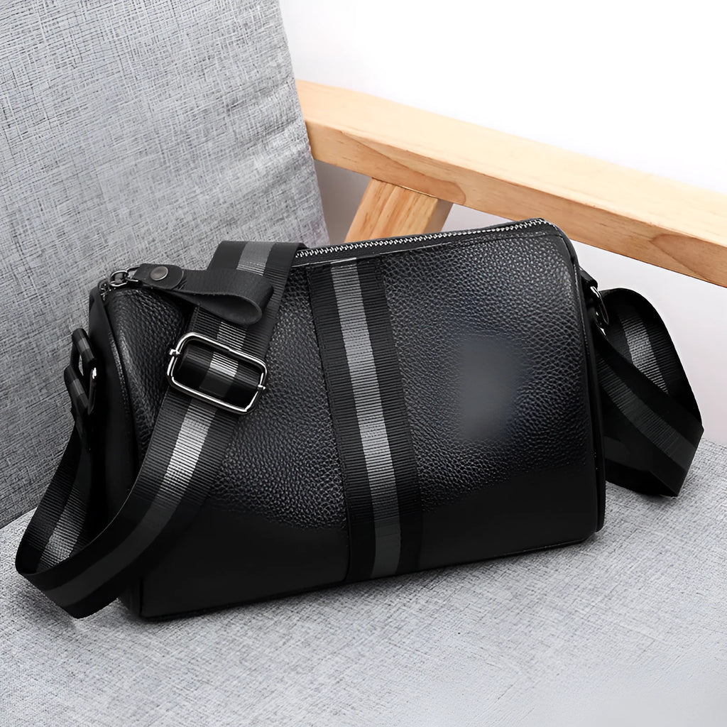 Black genuine leather one-shoulder crossbody bag with a large capacity.