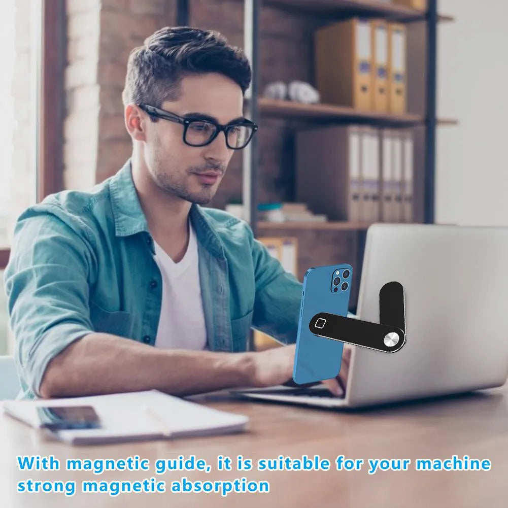 Black aluminium laptop phone holder mounted to computer monitor with smartphone attached