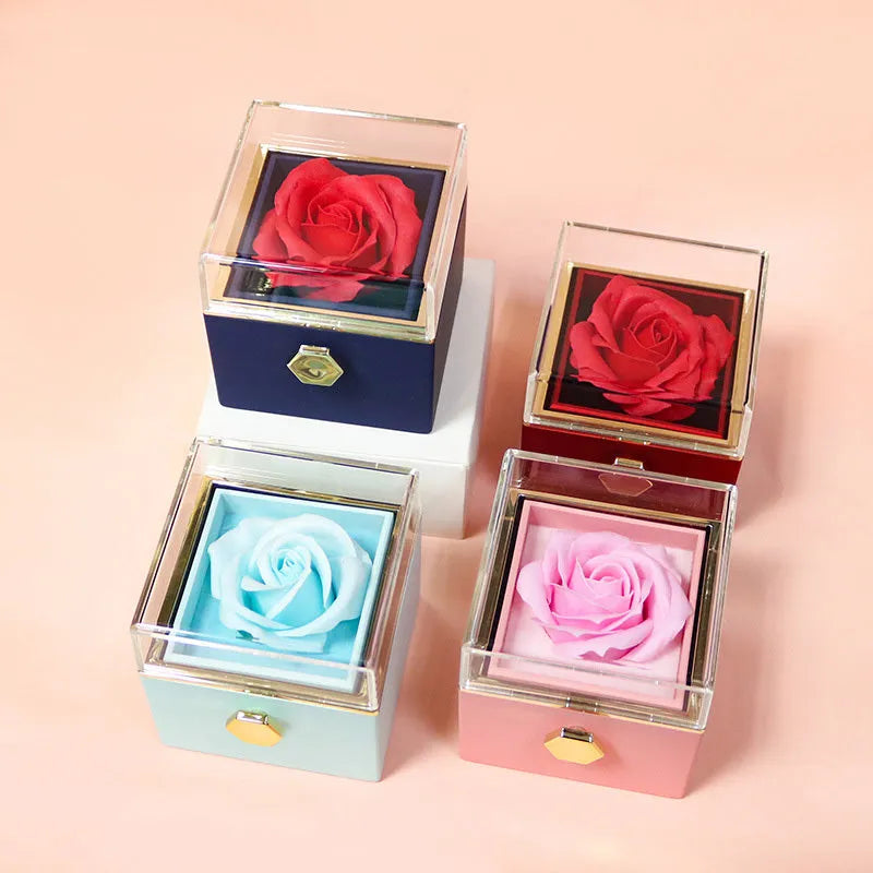 Rotating rose jewellery gift box with preserved real flower under acrylic cover and rotating drawer