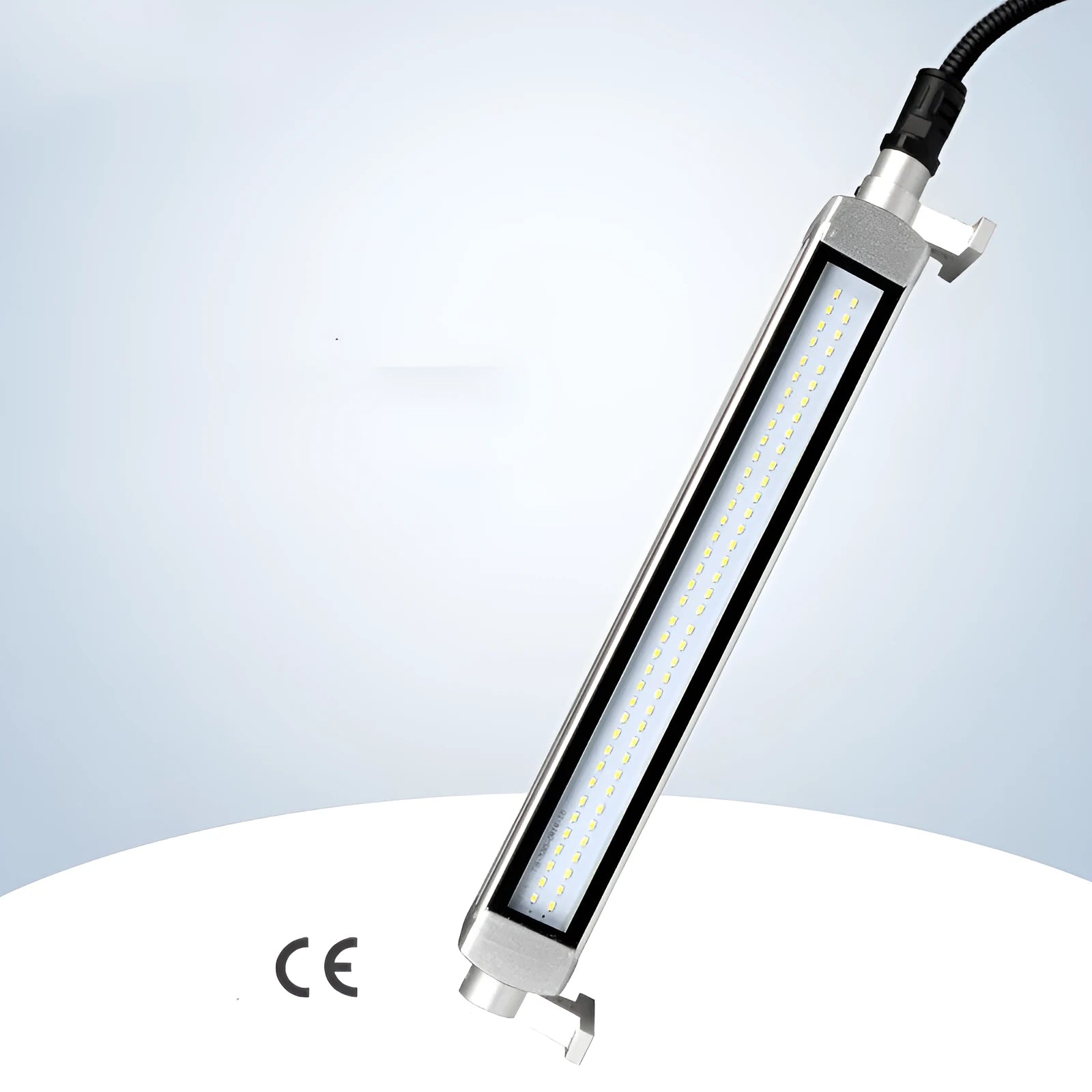 Long aluminium LED explosion-proof light strip with tempered glass cover for CNC lathe mounting.