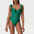 Women's grey one-piece swimsuit with an attached gauze skirt, showing double shoulder neckline style.