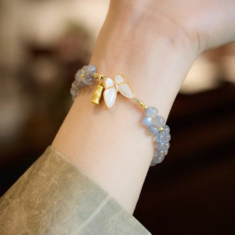 Handwoven women's bracelet with grey moonstone butterfly centrepiece on geometric design