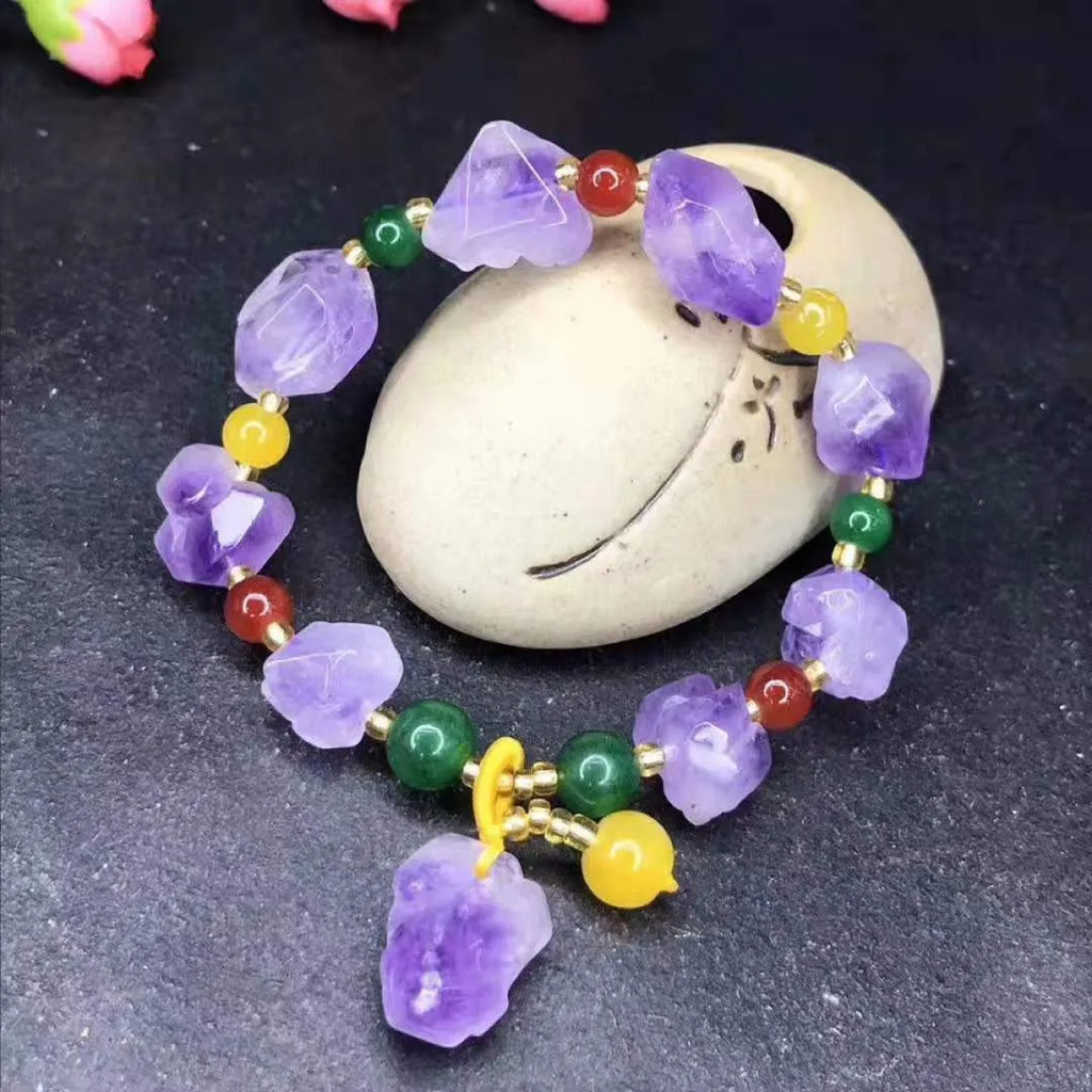 Natural shaped purple amethyst bead bracelet with a fu character charm for women.