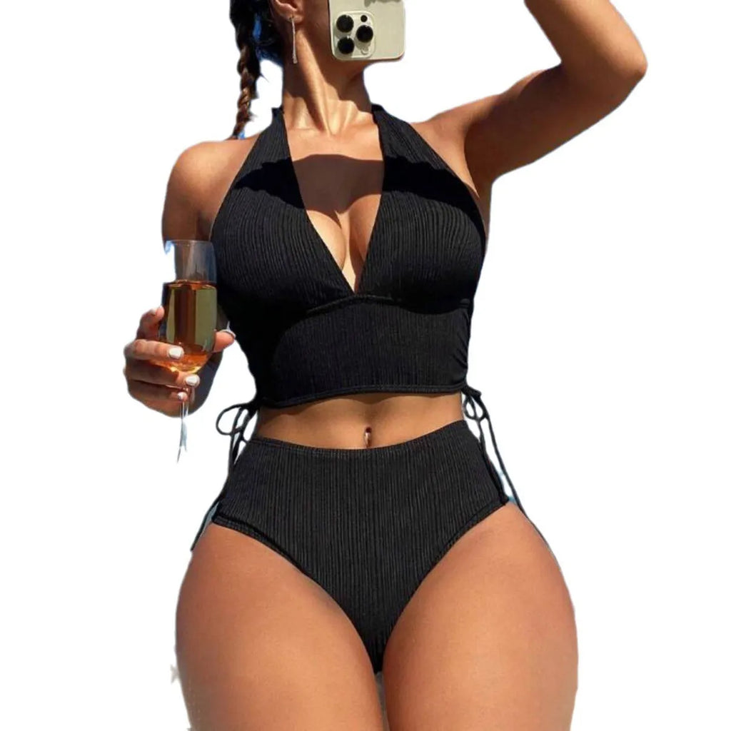 Women's black lace-up halter bikini set with brief bottoms on mannequin