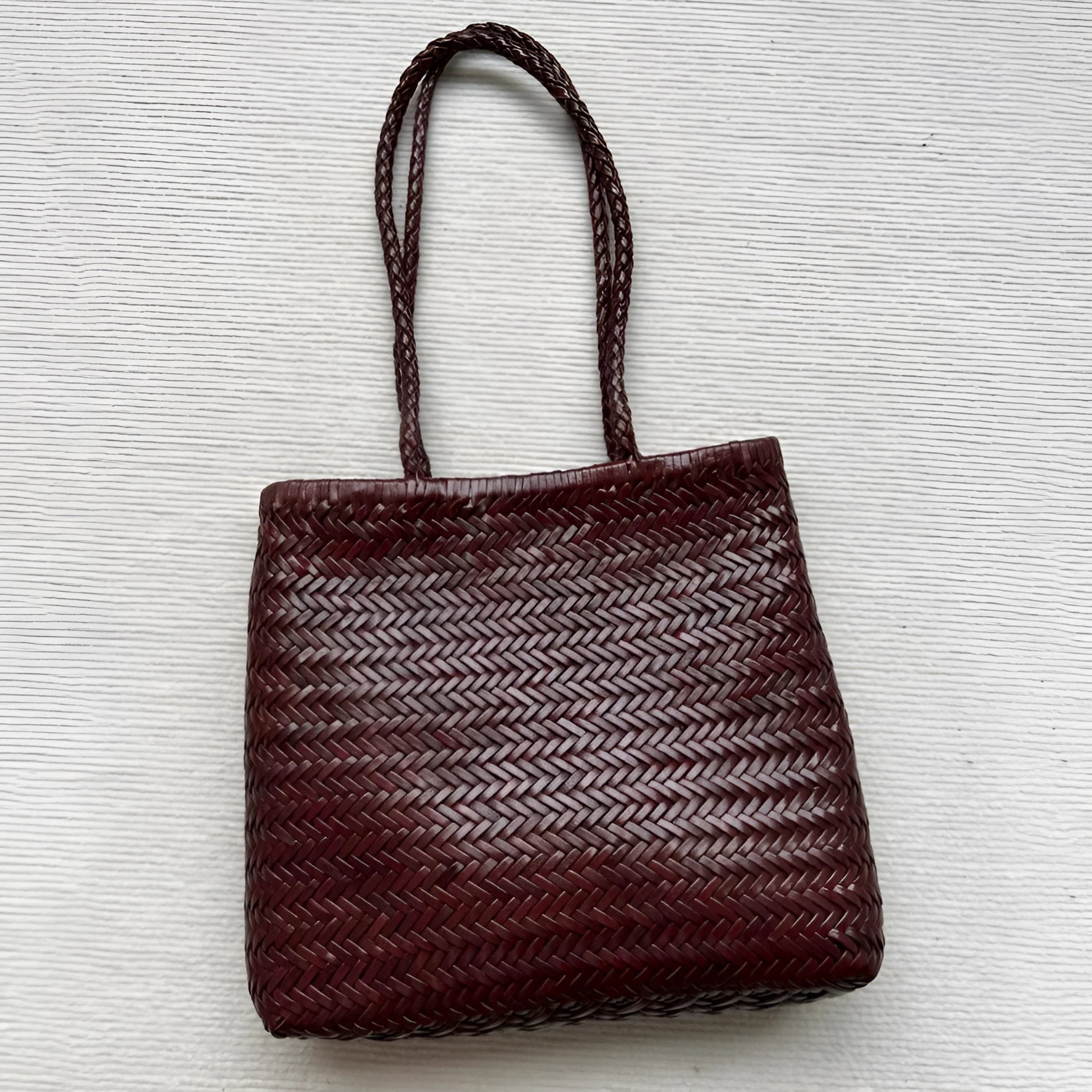 Brown handmade woven genuine leather shoulder tote bag with a front pocket
