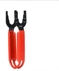 Orange steel pipe wrench with adjustable jaw on a workbench