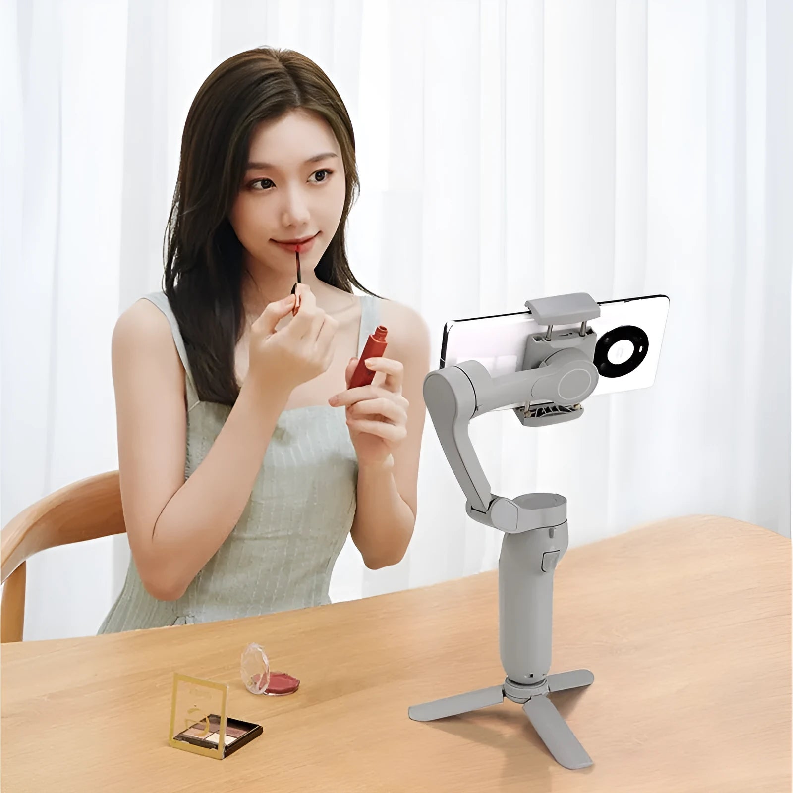L7B PRO folding three-axis gimbal stabiliser for mobile phones shown in folded and unfolded states.