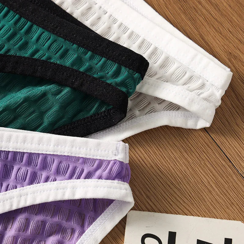 Men's low waist transparent lace underwear shorts in black, green, light purple, rose red, and white colours.