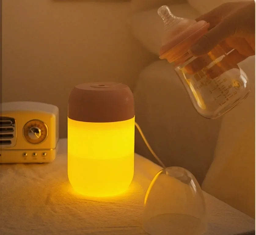 Small white cylindrical USB humidifier with aromatherapy function on desk