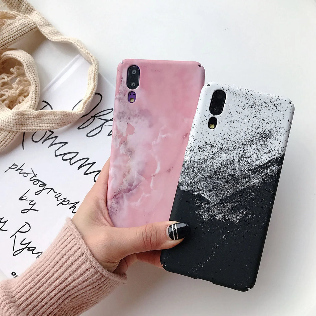 Black painted hard back phone case for Huawei models on a white background.