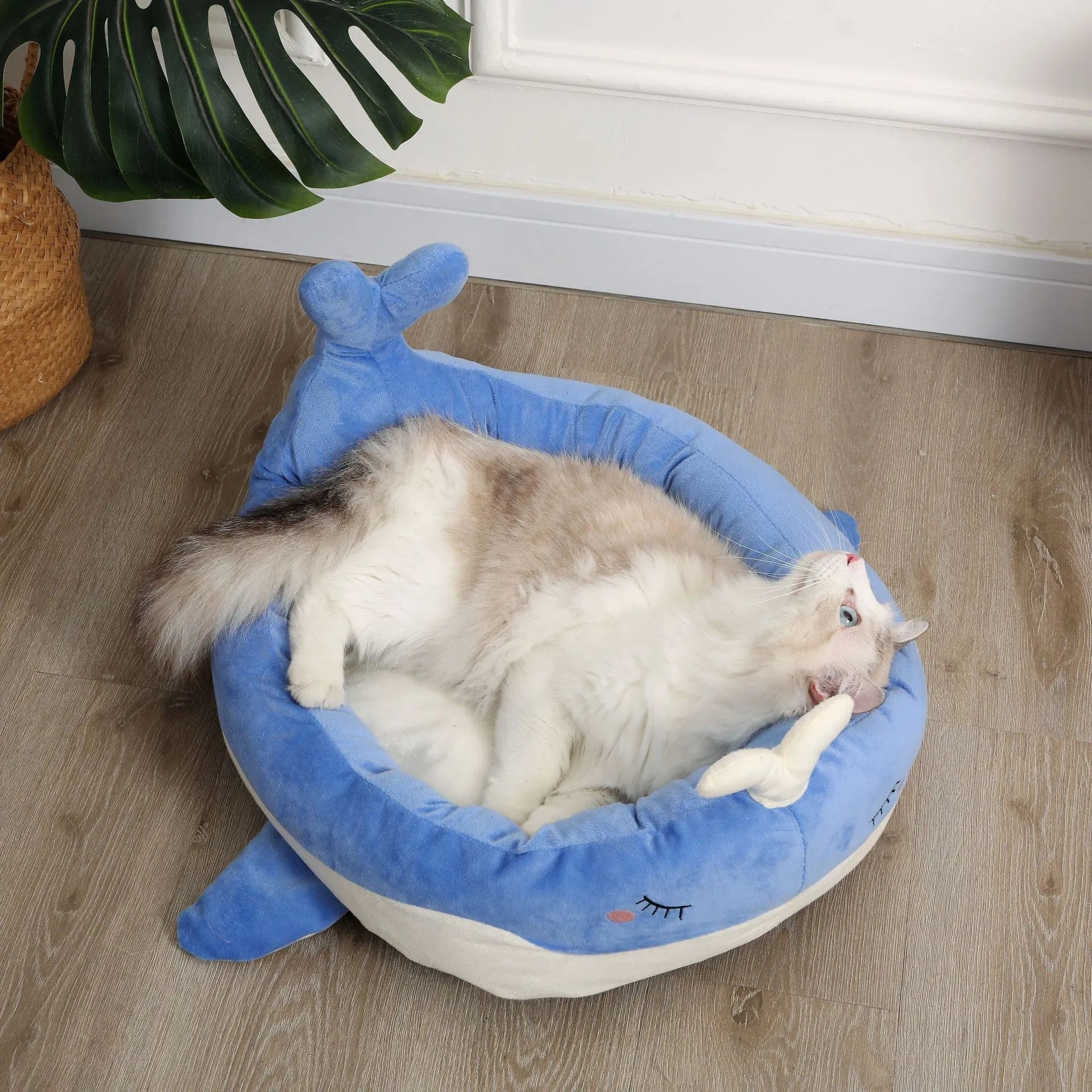 Blue duck-shaped fluffy pet bed sofa for a small dog, showing raised sides and soft material.