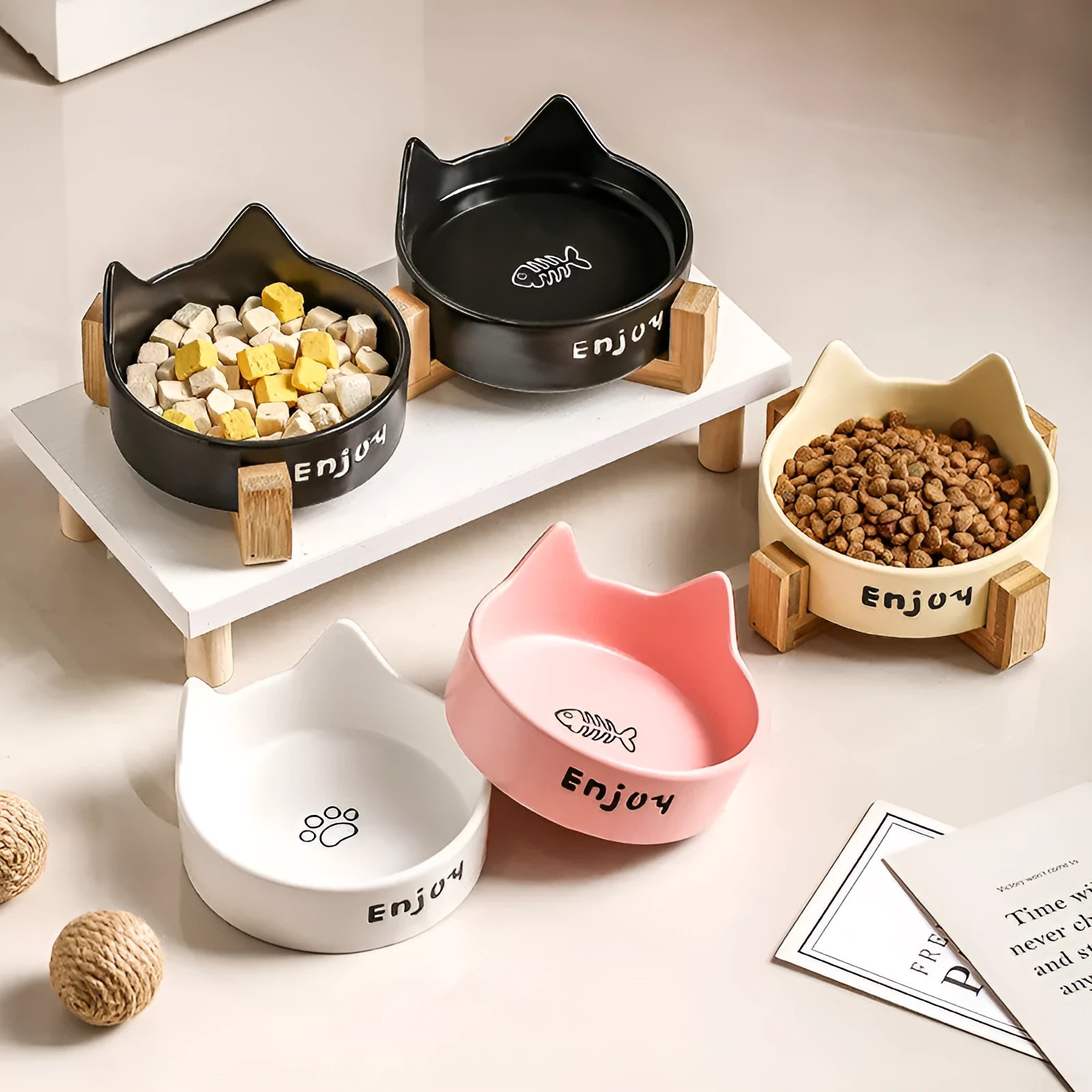 Porcelain cat bowl with wooden anti-tumble frame in pink with cat paw design