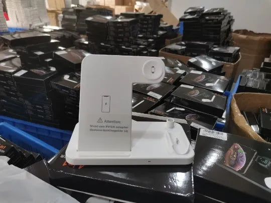 Black foldable 4-in-1 wireless charger showing MagSafe spot for iPhone and Apple Pencil charger, with EU UK US plug options.