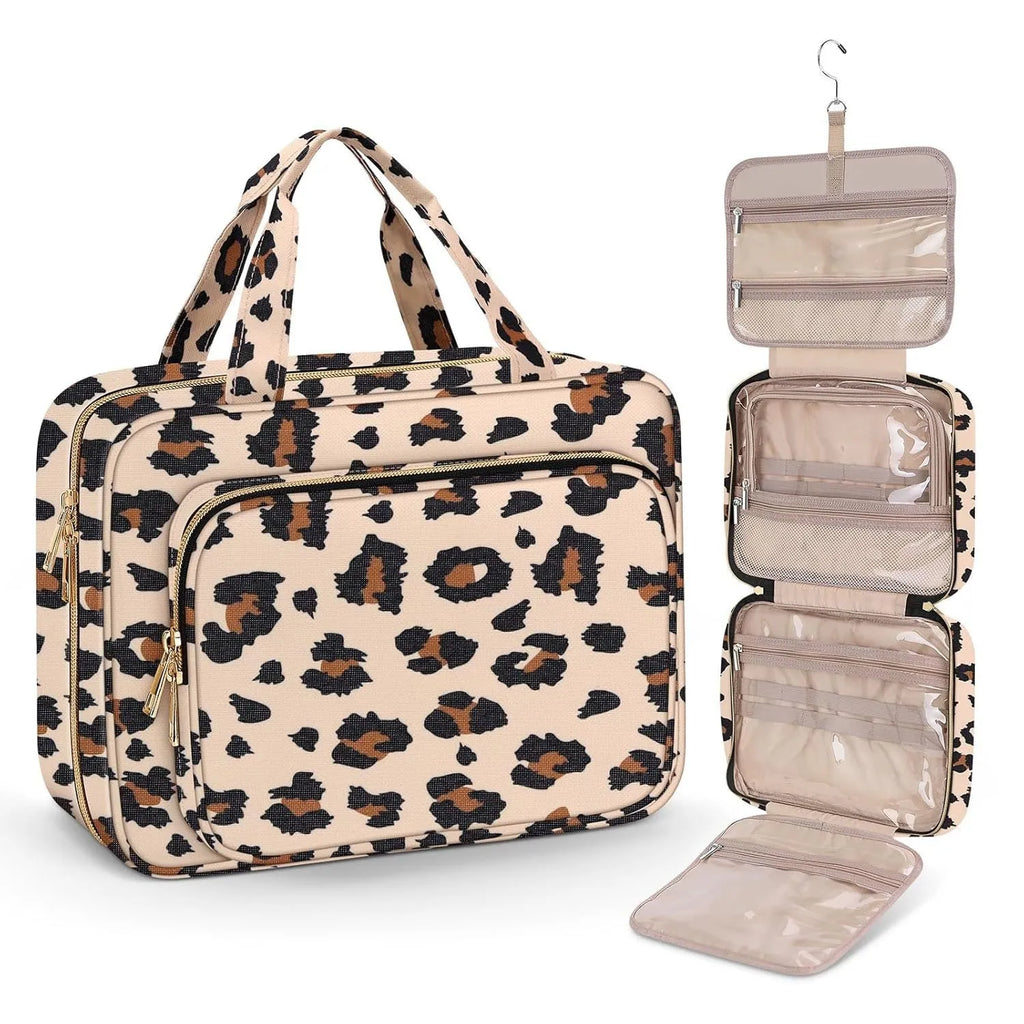 Large capacity black travel wash bag for cosmetics next to makeup items