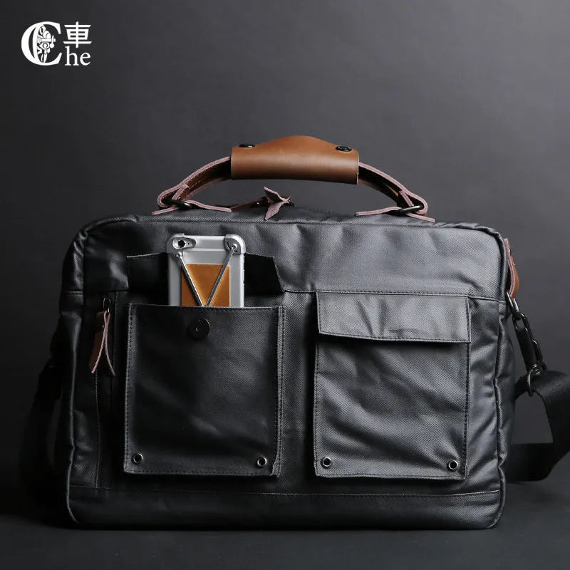 Dpark black laptop shoulder bag for a 14 or 15 inch business laptop, showing front pocket and strap.