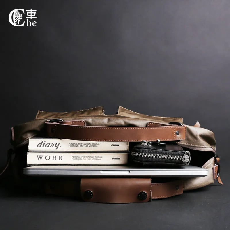 Dpark black laptop shoulder bag for a 14 or 15 inch business laptop, showing front pocket and strap.