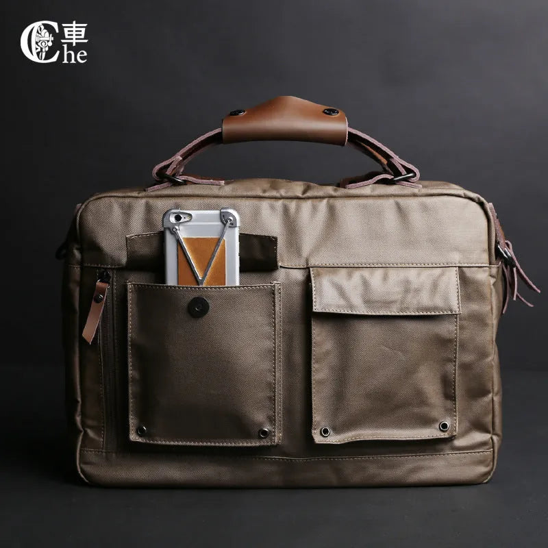 Dpark black laptop shoulder bag for a 14 or 15 inch business laptop, showing front pocket and strap.